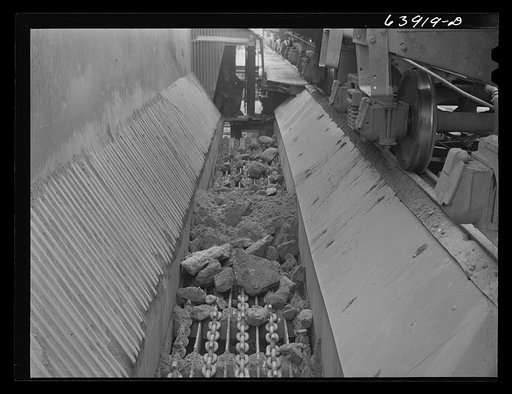 At concentration plant iron ore is first dumped onto these shams which help separate rock from ore. Near Bovey, Minnesota