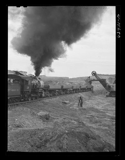 Untitled photo, possibly related to: Loading cars with giant power shovel at Danube iron mine near Bovey, Minnesota