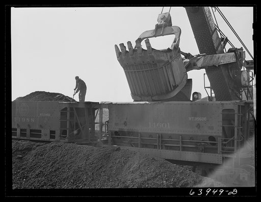 Untitled photo, possibly related to: Loading seventy ton cars with iron ore, Mahoning pit, Hibbing, Minnesota
