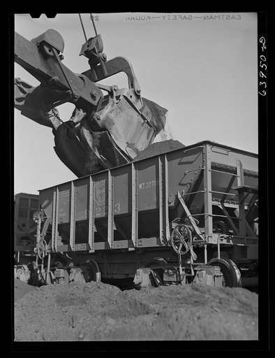 Loading seventy ton cars with iron ore. Mahoning pit, Hibbing, Minnesota