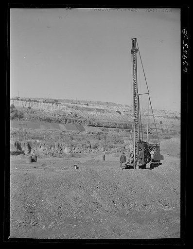 Untitled photo, possibly related to: Vertial drill boring hole for blasting crew. Mahoning pit, Hibbing, Minnesota
