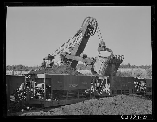 Untitled photo, possibly related to: Loading seventy ton cars with iron ore, Mahoning pit, Hibbing, Minnesota