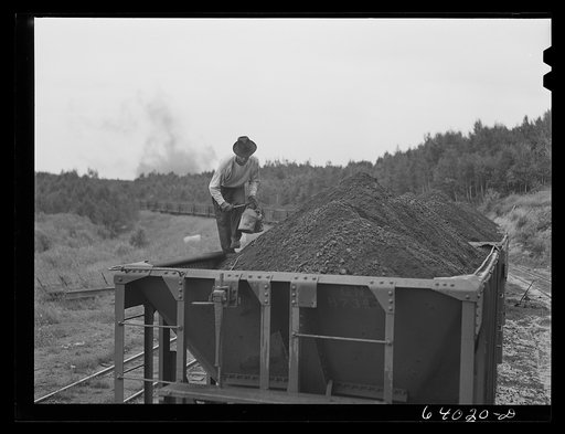 Taking sample of iron ore before it leaves the concentration plant. Bovey, Minnesota