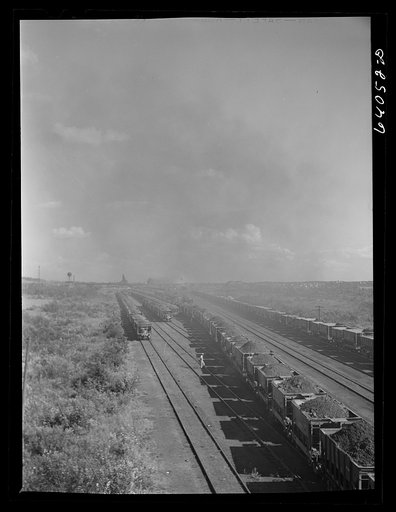 Seventy ton cars of iron ore in D.M. & I.R. railroad yards on way to Duluth ore docks