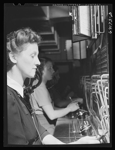Untitled photo, possibly related to: Telephone operator at Aberdeen proving grounds. She lives in dormitory for defense workers. Aberdeen, Maryland