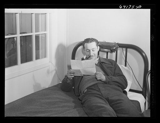 Defense worker reading a letter from home. He works at the proving grounds in Aberdeen, Maryland and lives in one of the FSA (Farm Security Administration) dormitories for defense workers