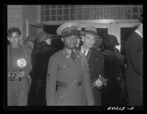Untitled photo, possibly related to: Washington, D.C. Christmas rush in the Greyhound bus terminal. Negro soldiers waiting for a bus