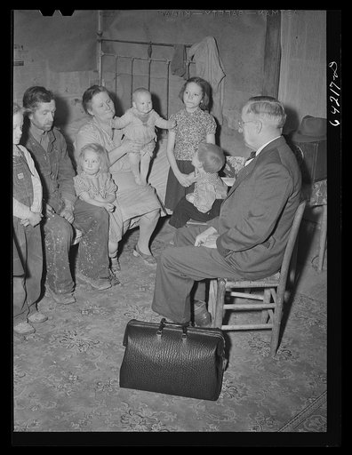 Scott County, Missouri. Country doctor visiting farm family