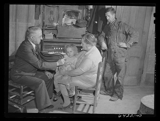 Scott County, Missouri. Doctor visits sick child at home