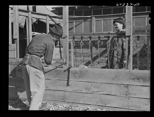 Untitled photo, possibly related to: Newton County, Missouri. Camp Crowder area. Farmer who spent the winter as a carpenter, dismantling the roadside accomodations he built for himself and family, prepares to go back to the farm
