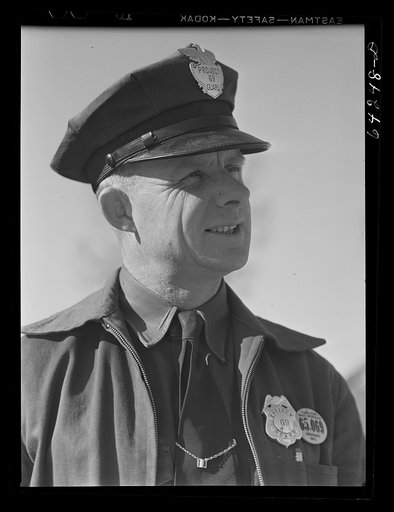 Newton County, Missouri. Camp Crowder area. Walter Manz, farmer whose land was bought up by the Army for construction at Camp Crowder, has moved to town and has a job as project guard. Farmers from the area bought by the Army were given preference in employment