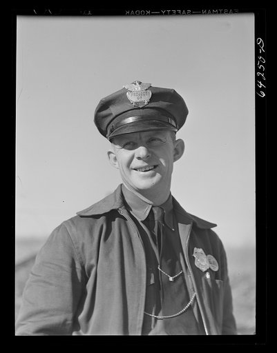 Untitled photo, possibly related to: Newton County, Missouri. Camp Crowder area. Walter Manz, farmer whose land was bought up by the Army for construction at Camp Crowder, has moved to town and has a job as project guard. Farmers from the area bought by the Army were given preference in employment