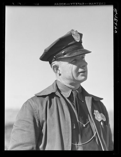 Untitled photo, possibly related to: Newton County, Missouri. Camp Crowder area. Walter Manz, farmer whose land was bought up by the Army for construction at Camp Crowder, has moved to town and has a job as project guard. Farmers from the area bought by the Army were given preference in employment