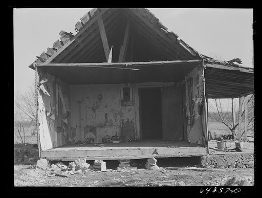 Newton County, Missouri. Camp Crowder area. Farmhouses on land bought by the Army are demolished when construction work moves close to them