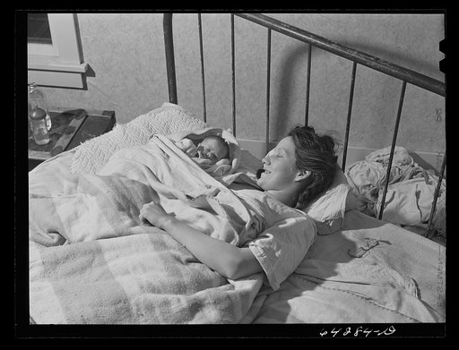 Bates County relocation project, Missouri. Daughter-in-law and new babe of the Green family. The Greens were hill farmers in the Ozarks when the Army bought up their land for Camp Crowder construction. With the aid of the FSA (Farm Security Administration), he will move to a farm in Bates County, Mi