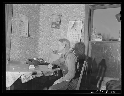 Untitled photo, possibly related to: Newton County, Missouri. Camp Crowder area. James Mallory in his Ozark farmhouse. His land has been bought by the Army for construction of Camp Crowder, and next week, with the aid of the FSA (Farm Security Administration), he is moving to 160 acres of land and a