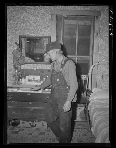 Untitled photo, possibly related to: Newton County, Missouri. Camp Crowder area. James Mallory in his Ozark farmhouse. His land has been bought by the Army for construction of Camp Crowder, and next week, with the aid of the FSA (Farm Security Administration), he is moving to 160 acres of land and a