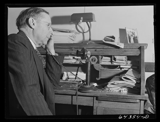Oran, Missouri. Doctor receiving call in his office