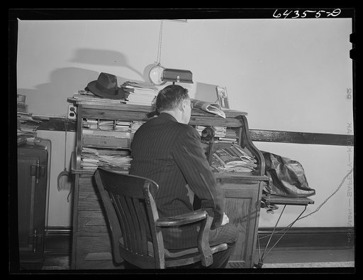Oran, Missouri. Doctor receiving call in his office