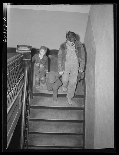 Chaffee, Missouri. Father and children leaving doctor's office