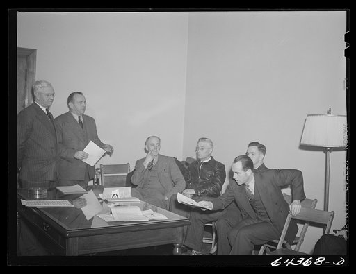 Untitled photo, possibly related to: Athens, Ohio. H.D. Palmer, executive director of the civilian defense council, addressing a meeting of the utilities division, including representatives of power, gas, electric, telephone companies
