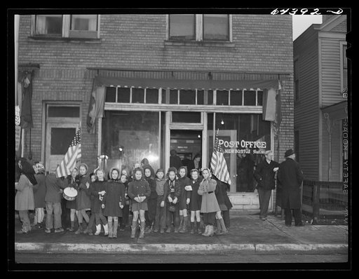 Untitled photo, possibly related to: New Boston, Ohio. Schoolchildren at the post office to buy defense stamps