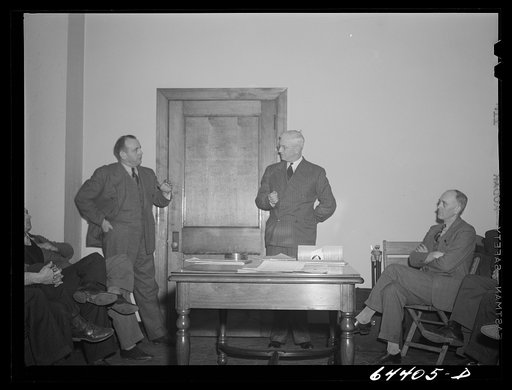 Untitled photo, possibly related to: Athens, Ohio. H.D. Palmer, executive director of the civilian defense council, addressing a meeting of the utilities division, including representatives of power, gas, electric, telephone companies