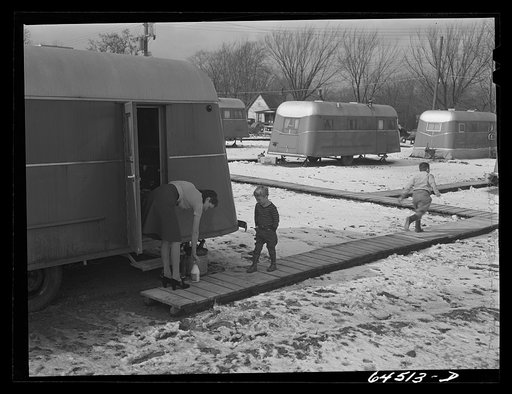 Untitled photo, possibly related to: Burlington, Iowa. Acres unit, FSA (Farm Security Administration) trailer camp. Frank Barker and family at Burlington ordnance plant