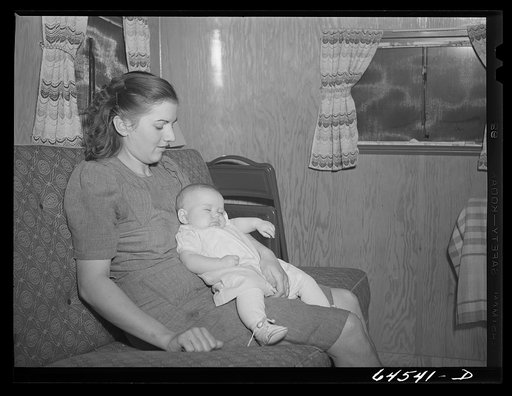 Untitled photo, possibly related to:  Burlington, Iowa. Sunnyside unit of FSA (Farm Security Administration) camp. Simmons family in their trailer for workers at Burlington ordnance plant