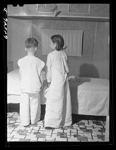 Untitled photo, possibly related to: Burlington, Iowa. Acres unit, FSA (Farm Security Administration) trailer camp. Cecil Patrick's kids going to bed in their trailer for workers at Burlington ordnance plant