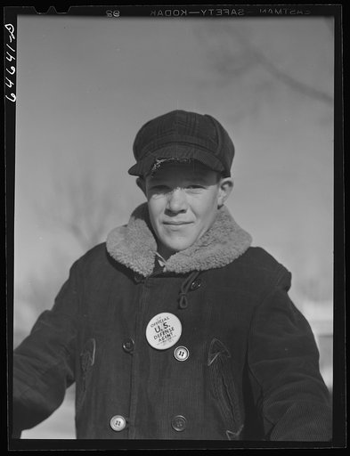 Aberdeen, South Dakota. Newsboy selling defense savings stamps