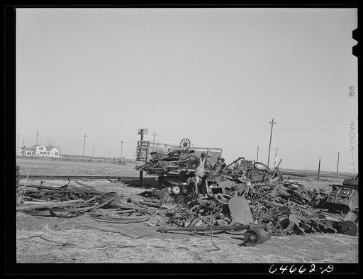 Northville, South Dakota. Loading scrap iron onto truck