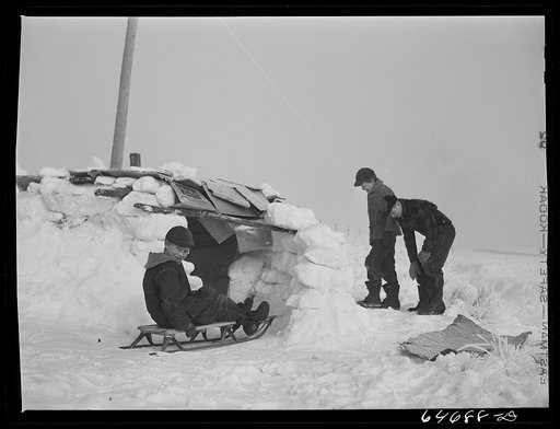 Untitled photo, possibly related to: Morton County, North Dakota. Building snow fort at noon recess at a rural school