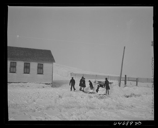 Morton County, North Dakota. Building snow fort at noon recess at a rural school