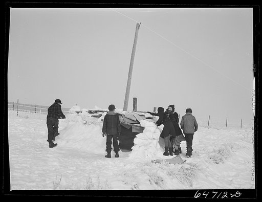 Morton County, North Dakota. Building snow fort at noon recess at a rural school