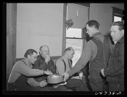 Untitled photo, possibly related to: Adams County, North Dakota. Farmers brought their own lunch to an all day Food for Victory meeting. Coffee was served by one of the ladies. The meeting was held in the rural school house