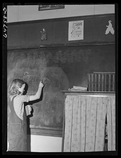 Williams County, North Dakota. Child at blackboard in a rural school