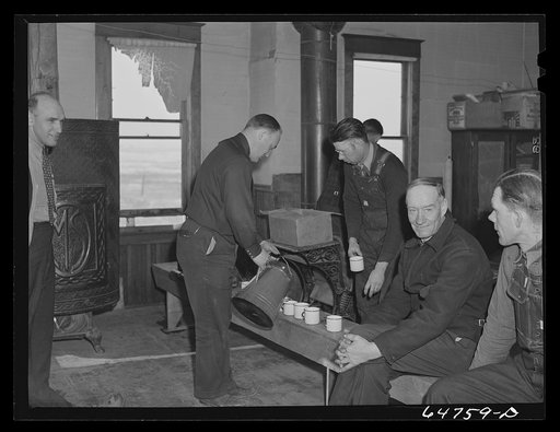 Untitled photo, possibly related to: Adams County, North Dakota. Farmers brought their own lunch to an all-day Food for Victory meeting. Coffee was served by one of the ladies. The meeting was held in the rural school house