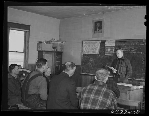 Untitled photo, possibly related to: Adams County, North Dakota. County agent addressing farmers Food for Victory meeting in a rural schoolhouse