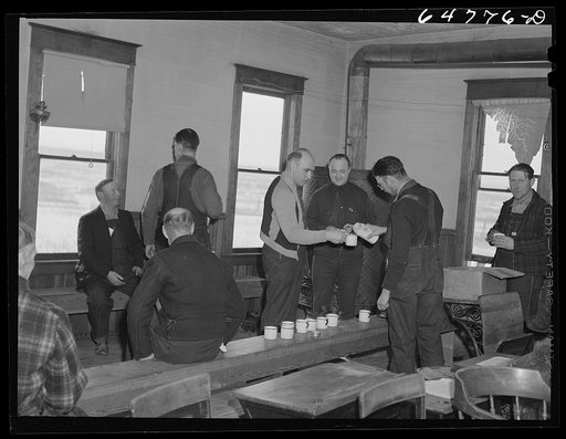 Adams County, North Dakota. Farmers brought their own lunch to an all day Food for Victory meeting. Coffee was served by one of the ladies. The meeting was held in the rural school house