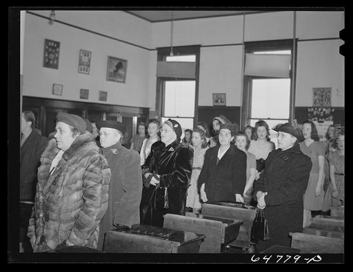 Epping, North Dakota. Women singing "God Bless America" at close of a meeting held in high school to promote sale of defense stamps and bonds