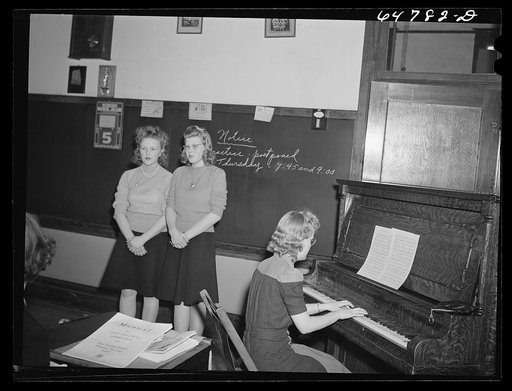 Epping, North Dakota. High school girls singing "Remember Pearl Harbor" at meeting of the women of the town to promote sale of defense bonds and stamps