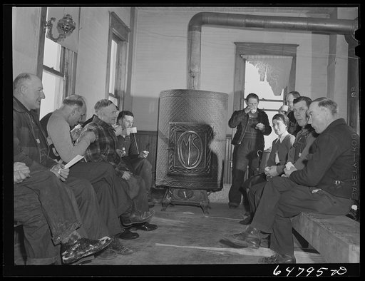 Adams County, North Dakota. Farmers brought their own lunch to an all day Food for Victory meeting. Coffee was served by one of the ladies. The meeting was held in the rural schoolhouse