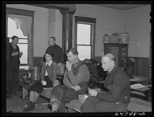 Adams County, North Dakota. Farmers brought their own lunch to an all day Food for Victory meeting. Coffee was served by one of the ladies. The meeting was held in the rural school house