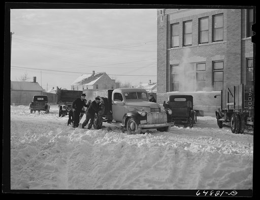 Hettinger, North Dakota. Pushing a truck stuck in the snow