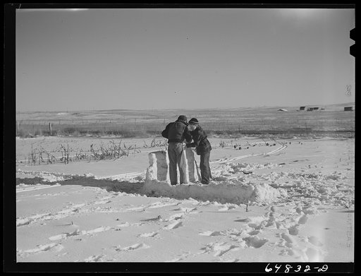 Dunn Center, North Dakota. Boys building snow fort