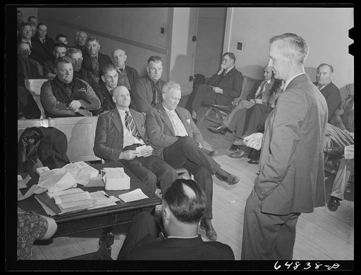Williston, North Dakota. County commissioner addressing meeting of farmers' union to protest to the county commissioners the selling of land to large corporation farms in Williams County