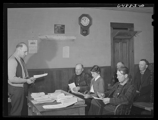 Adams County, North Dakota. FSA (Farm Security Administration) County supervisor Glenn Emch addressing farmers' Food for Victory meeting held in a rural schoolhouse