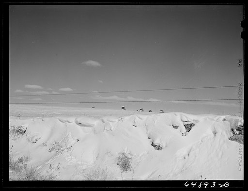 Reeder, North Dakota. Snow banks and tops of grain elevators