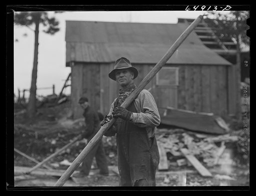 Untitled photo, possibly related to: Kalispell, Montana. Rolling logs into the pond at FSA (Farm Security Administration) cooperative sawmill